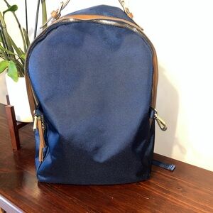 Tommy Bahama brand navy blue backpack saddle brown leather men’s women’s unisex